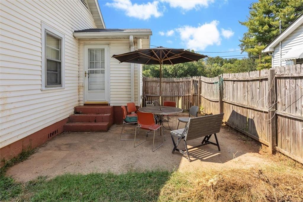 2523 Maple Road Southeast Rome, GA 30161 - Photo 21 of 30 a view of a patio with a table and chairs