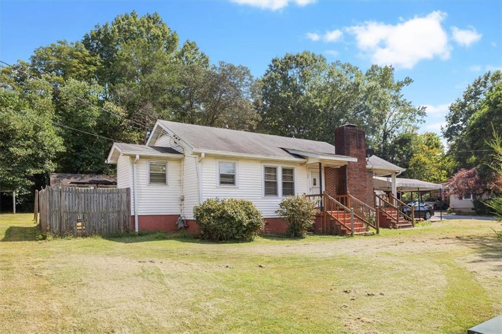 2523 Maple Road Southeast Rome, GA 30161 - Photo 22 of 30 a view of a house with backyard and sitting area