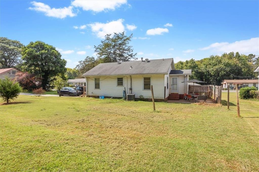 2523 Maple Road Southeast Rome, GA 30161 - Photo 26 of 30 a house view with swimming pool in front of it