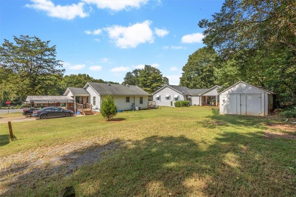 2523 Maple Road Southeast Rome, GA 30161 - Photo 27 of 30 a front view of a house with garden