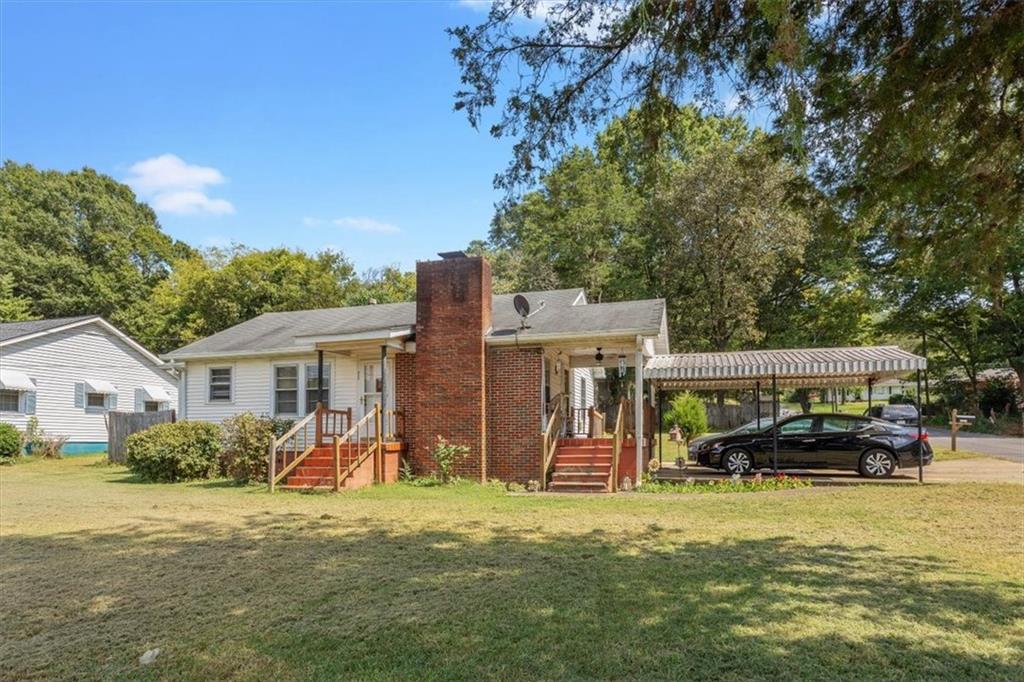 2523 Maple Road Southeast Rome, GA 30161 - Photo 4 of 30 a view of a house with backyard porch and sitting area