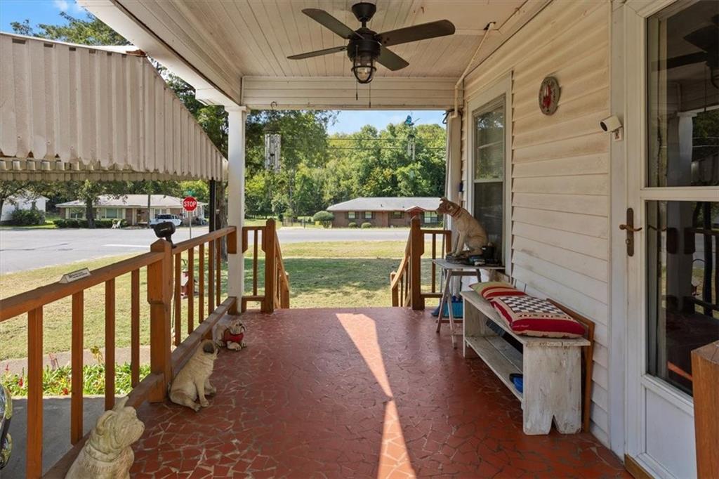 2523 Maple Road Southeast Rome, GA 30161 - Photo 7 of 30 a view of a balcony with chairs and wooden floor