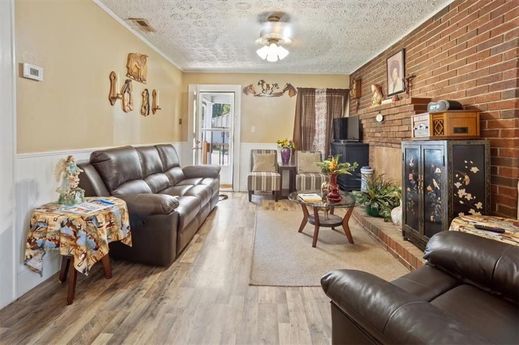 2523 Maple Road Southeast Rome, GA 30161 - Photo 9 of 30 a living room with furniture and a large window