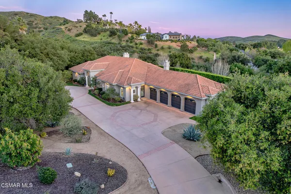 a aerial view of a house with a yard