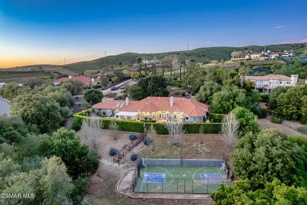 an aerial view of a house with a garden