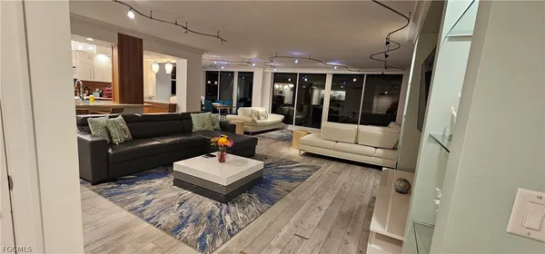 a living room with furniture and large window