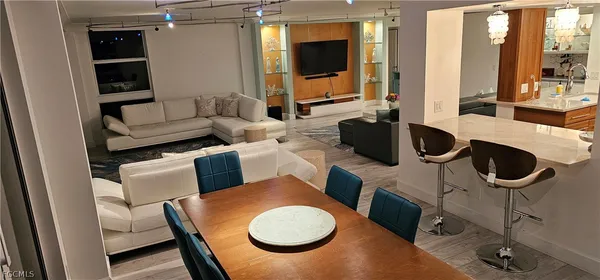 a bedroom with a bed and a mirror