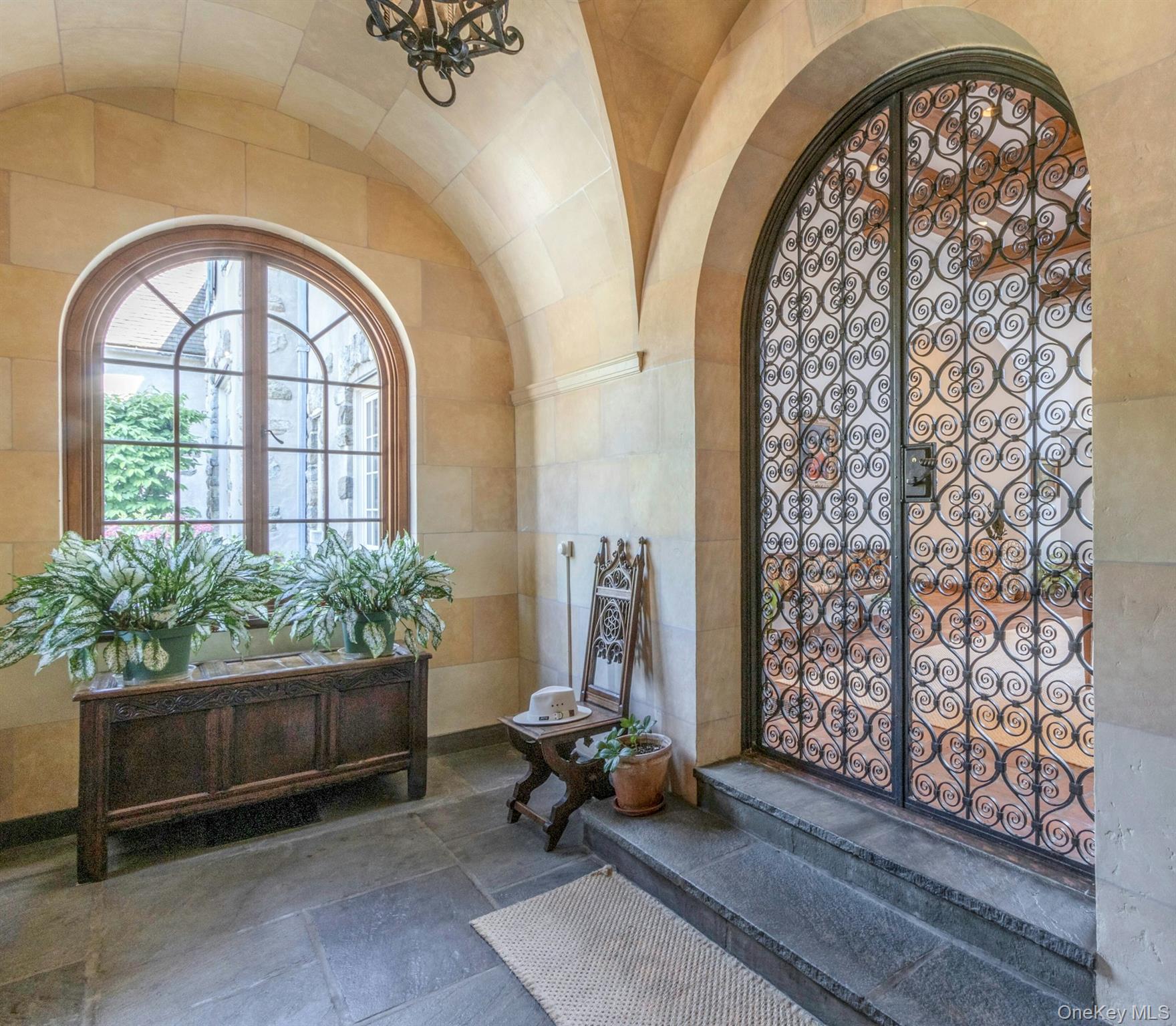 120 Ridge Road Tuxedo Park, NY 10987 - Photo 4 of 50 Foyer entrance with arched walkways, tile walls, and lofted ceiling