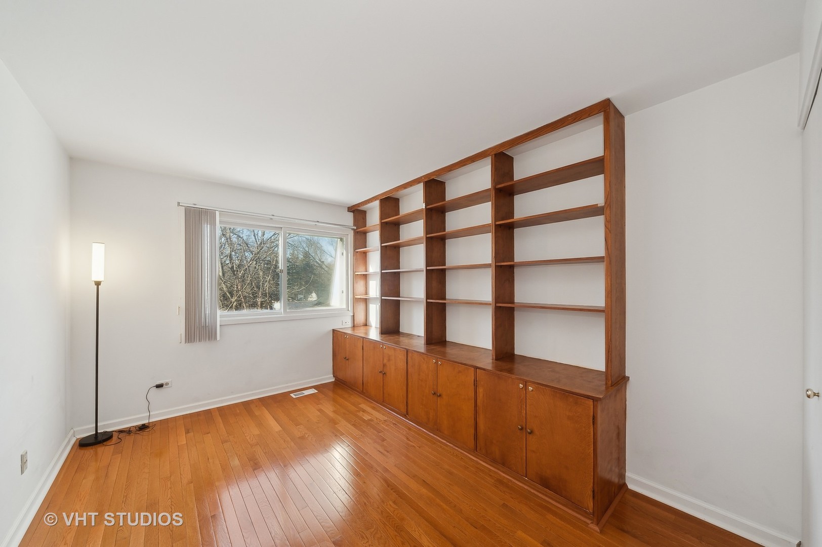 307 Pin Oak Drive Wilmette, IL 60091 - Photo 13 of 18 a view of empty room with wooden floor and fan
