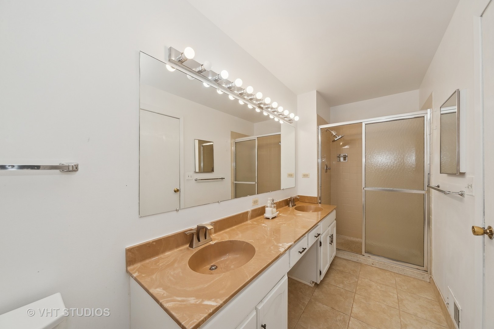 307 Pin Oak Drive Wilmette, IL 60091 - Photo 14 of 18 a bathroom with a sink double vanity and a mirror