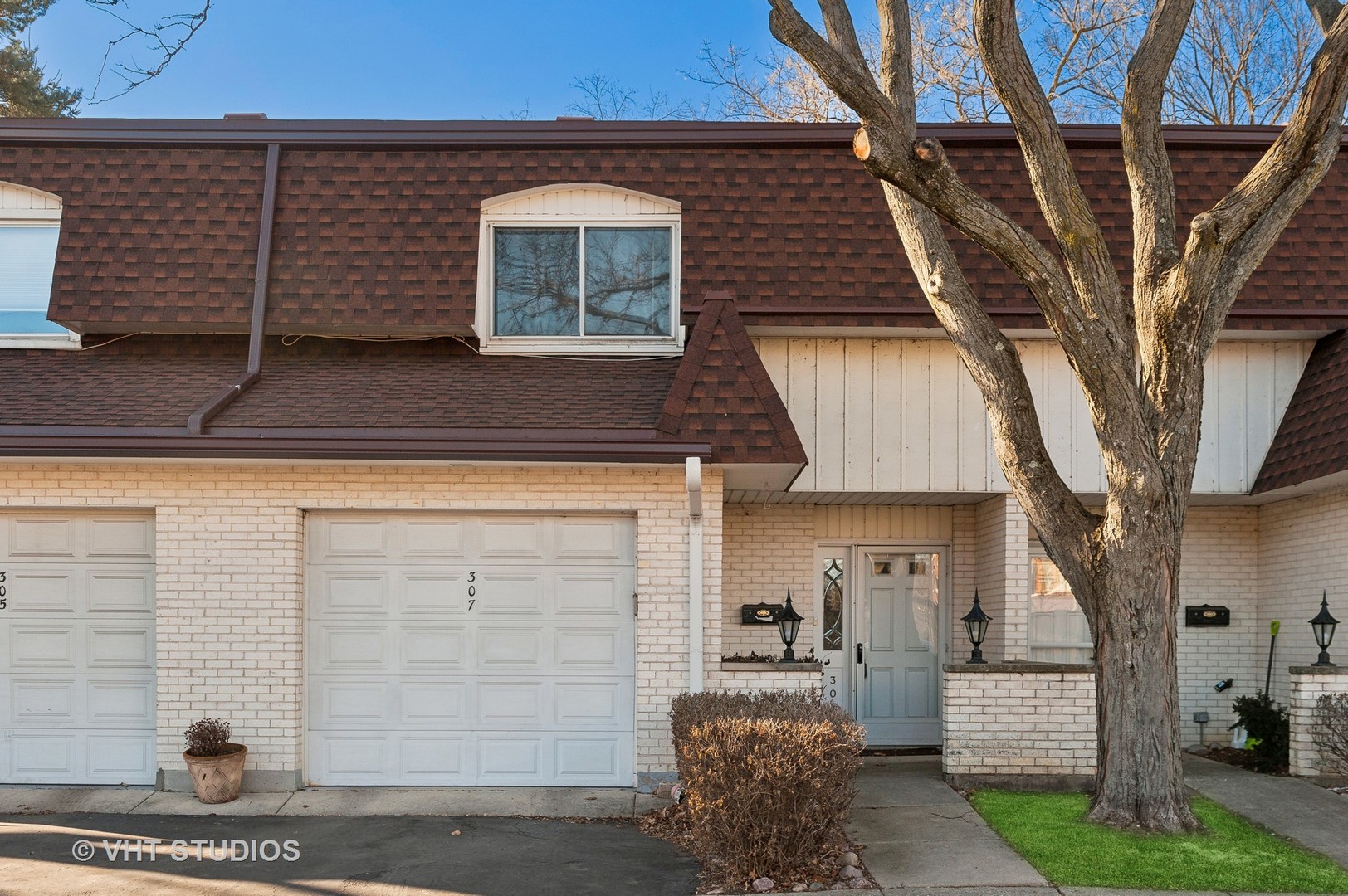 307 Pin Oak Drive Wilmette, IL 60091 - Photo 2 of 18 a front view of a house with garage