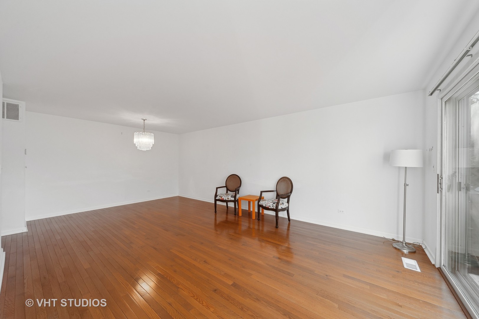 307 Pin Oak Drive Wilmette, IL 60091 - Photo 4 of 18 a view of a room with wooden floor and lounge chair