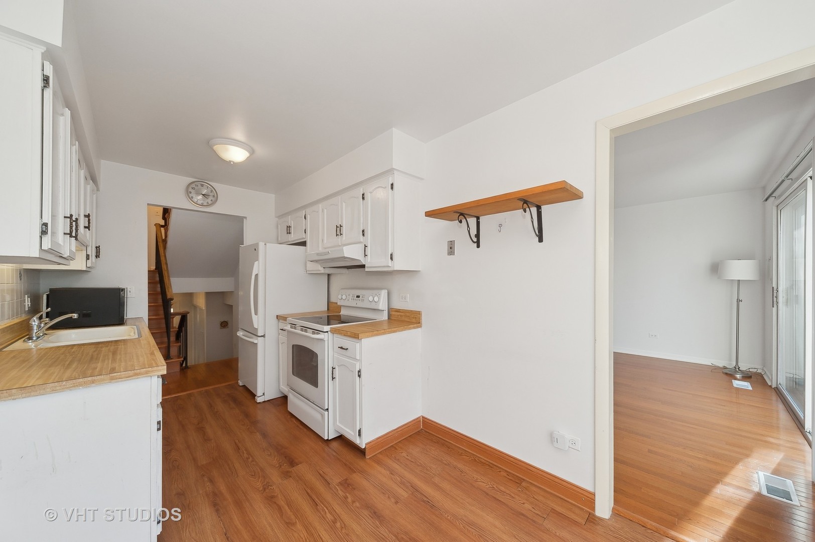 307 Pin Oak Drive Wilmette, IL 60091 - Photo 8 of 18 a kitchen that has a lot of white cabinets and stainless steel appliances