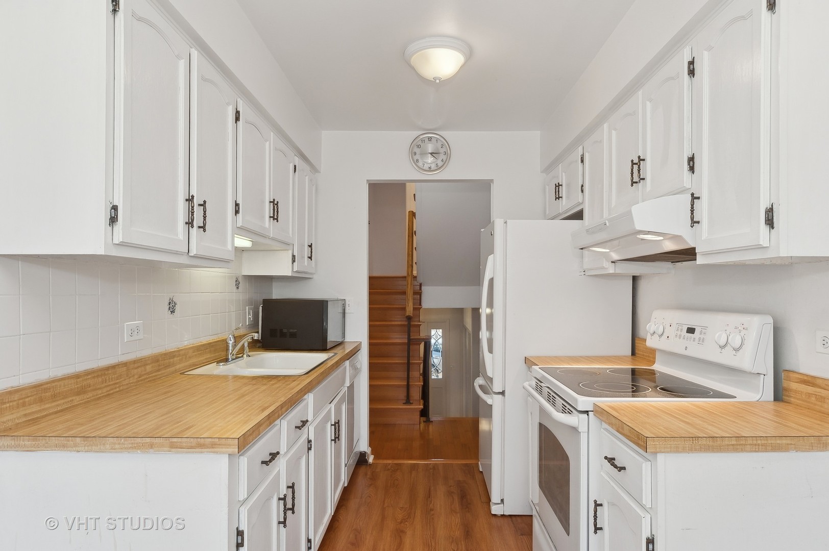 307 Pin Oak Drive Wilmette, IL 60091 - Photo 9 of 18 a kitchen with kitchen island granite countertop a sink a stove and refrigerator