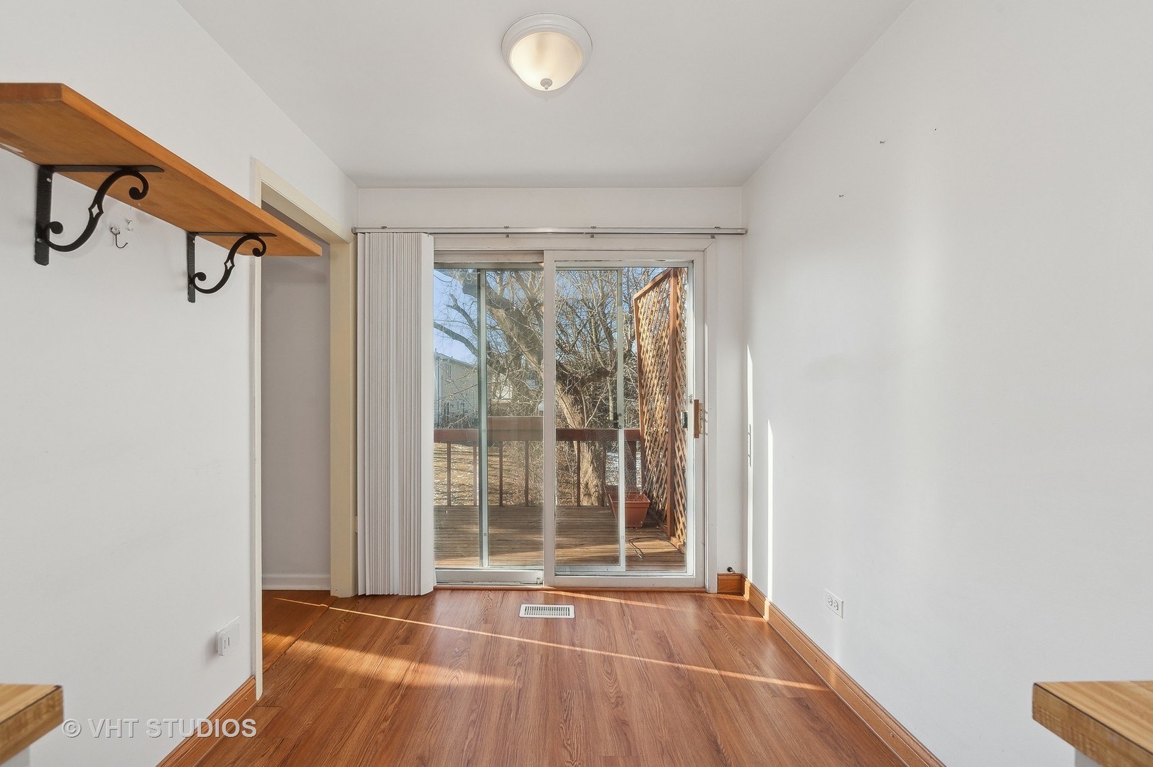307 Pin Oak Drive Wilmette, IL 60091 - Photo 10 of 18 a view of an empty room with glass door