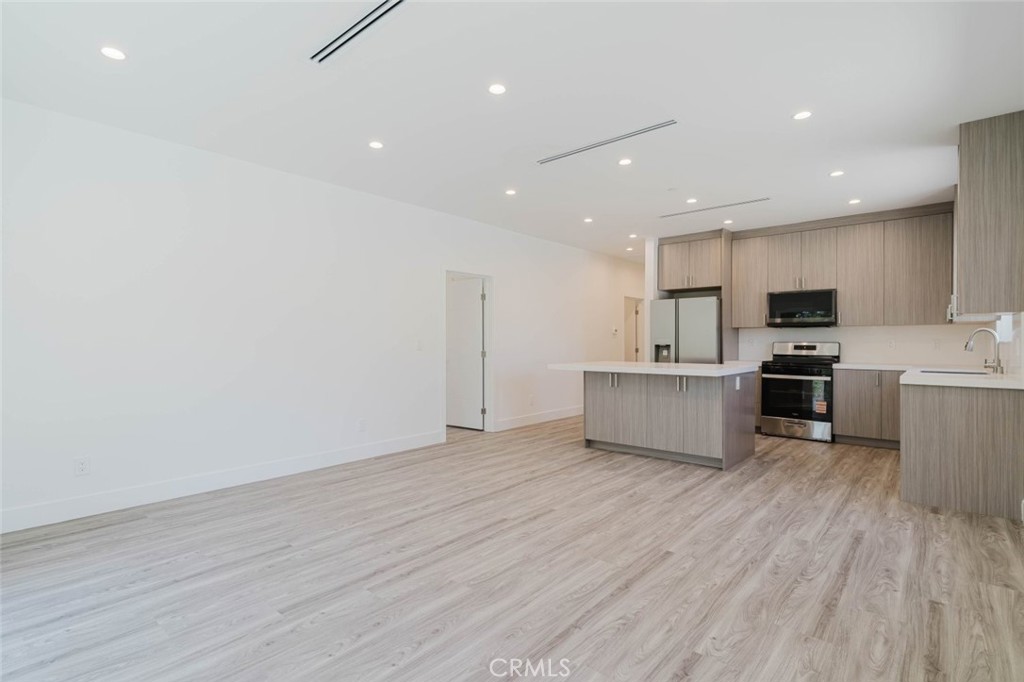 17846 Rinaldi Street Granada Hills, CA 91344 - Photo 12 of 34 a view of kitchen with microwave and cabinets