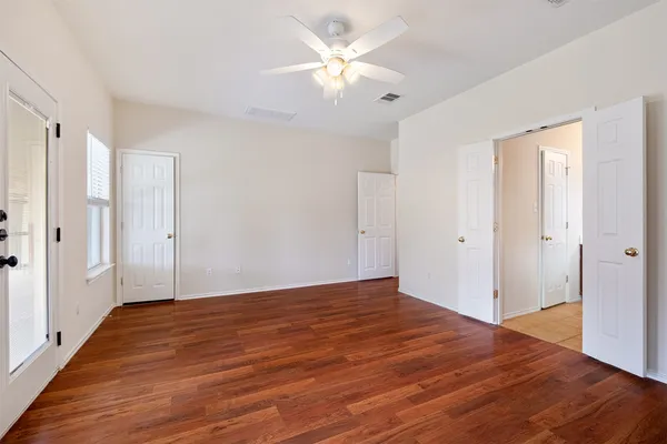 a view of room window and wooden floor