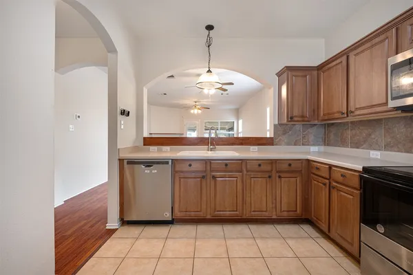 a kitchen with a sink and cabinets