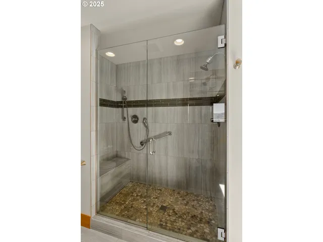 a view of bathroom with a sink and mirror