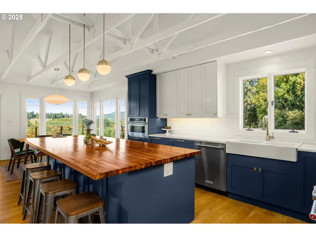 a kitchen with a sink and wooden cabinets