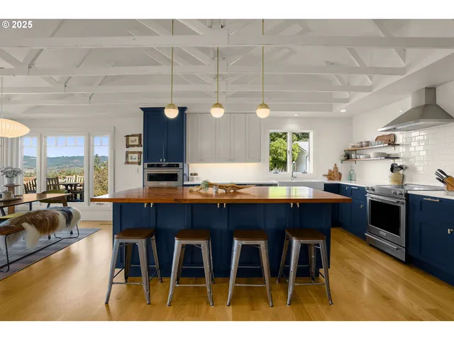 a dining room with a wooden table and chairs