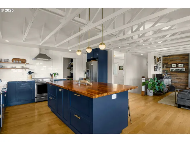 a kitchen with sink cabinets and wooden floor