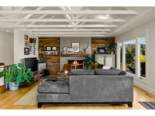 a living room with furniture and a potted plant