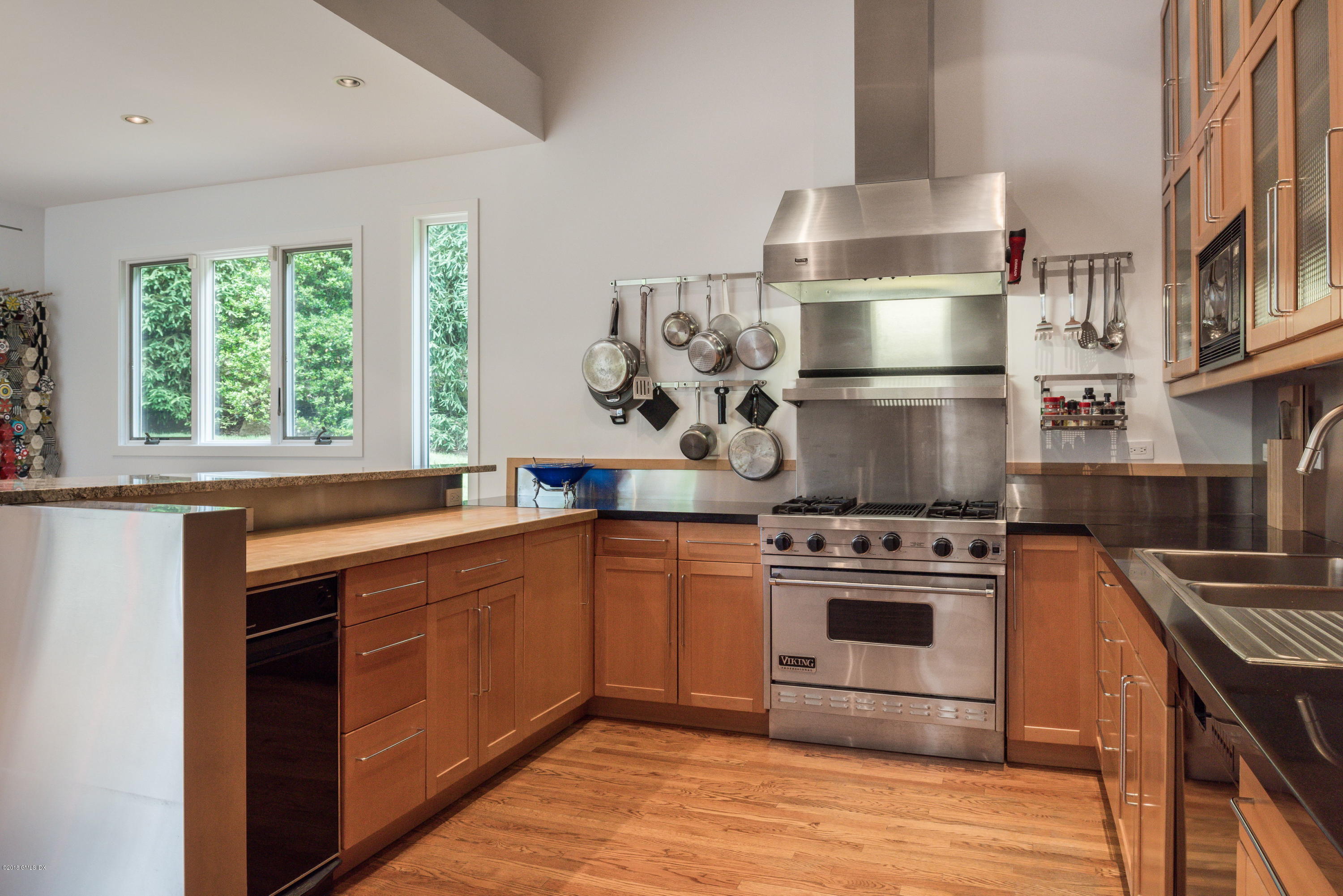 491 Riversville Road Greenwich, CT 06831 - Photo 13 of 30 a kitchen with stainless steel appliances granite countertop a stove a sink and a refrigerator