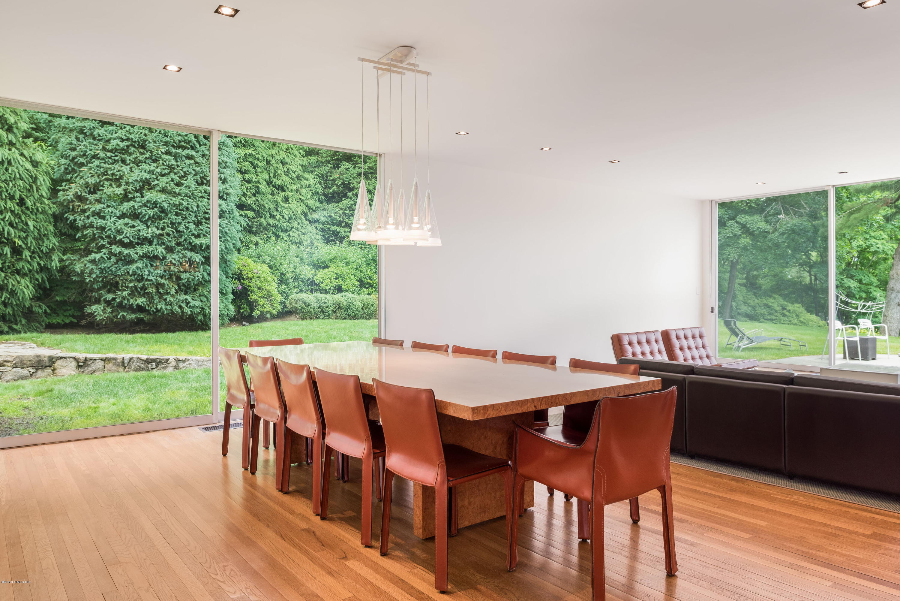 491 Riversville Road Greenwich, CT 06831 - Photo 16 of 30 a view of a dining room with furniture window and wooden floor