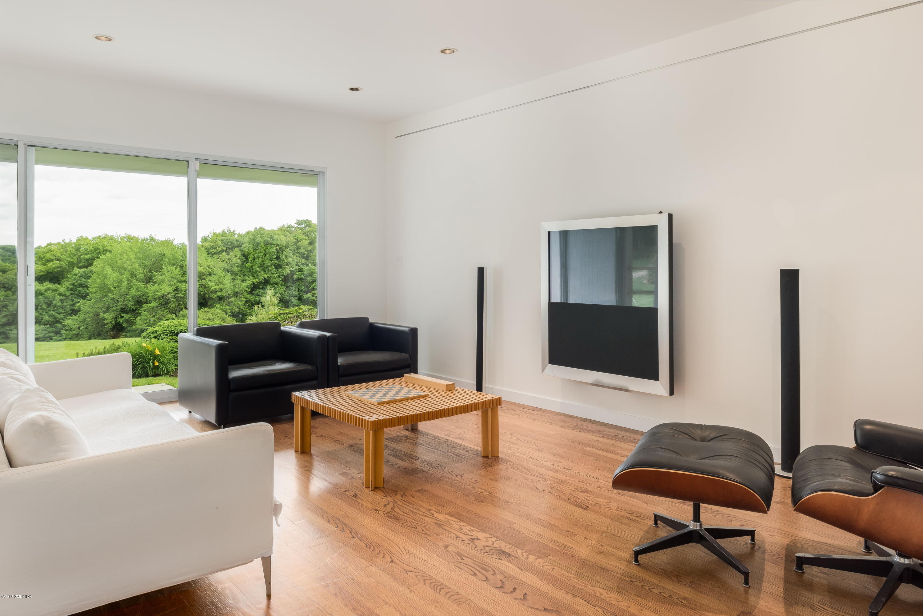 491 Riversville Road Greenwich, CT 06831 - Photo 17 of 30 a living room with furniture and a flat screen tv