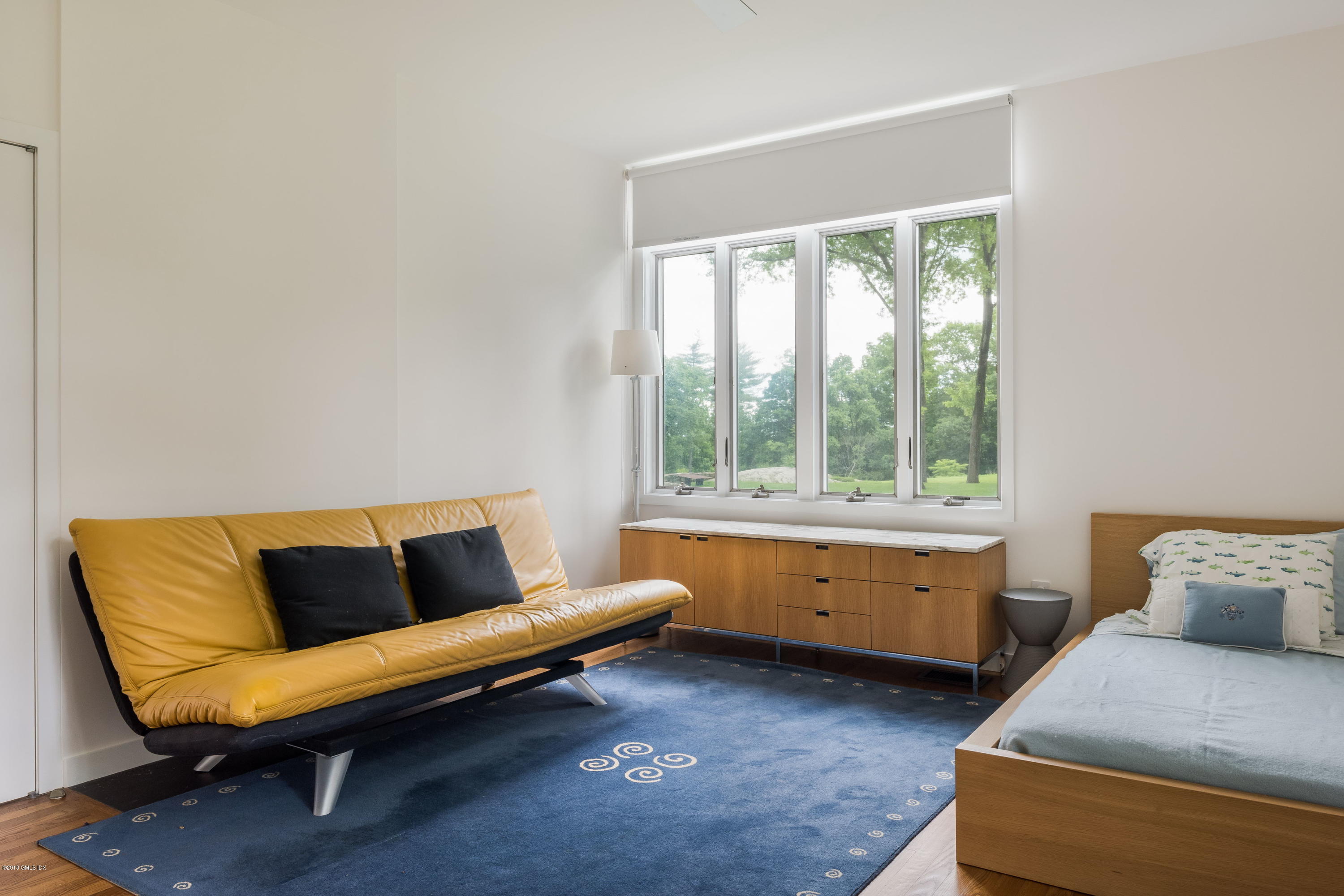 491 Riversville Road Greenwich, CT 06831 - Photo 19 of 30 a living room with furniture and a window