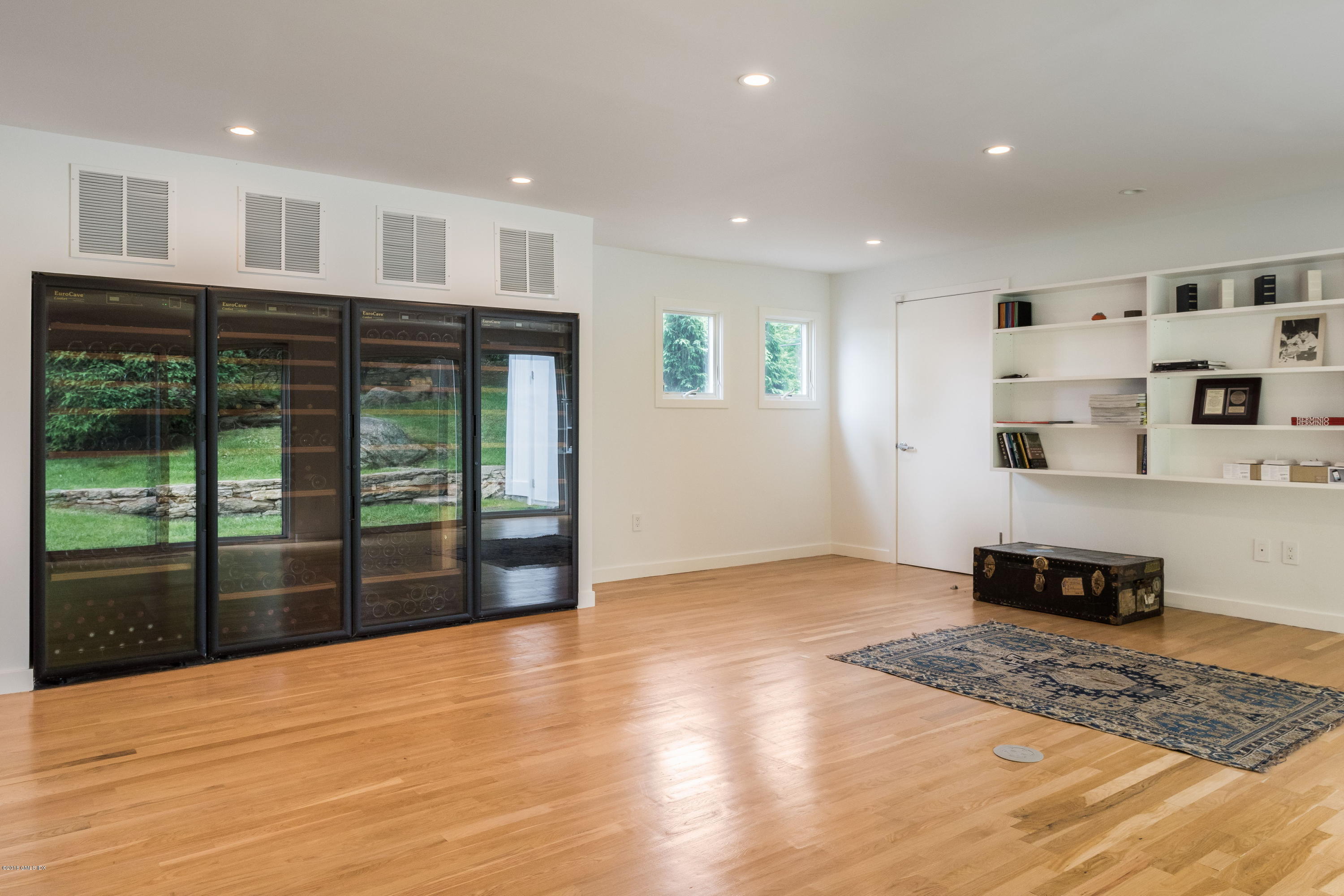 491 Riversville Road Greenwich, CT 06831 - Photo 20 of 30 a view of empty room with wooden floor and fan