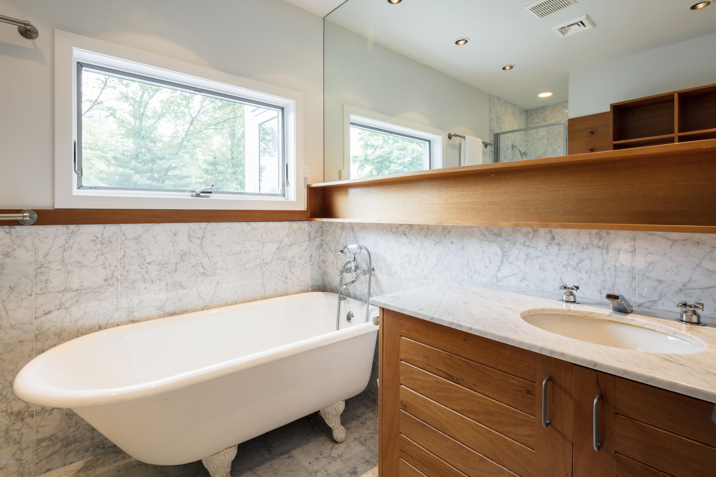 491 Riversville Road Greenwich, CT 06831 - Photo 24 of 30 a bathroom with a bathtub and a sink