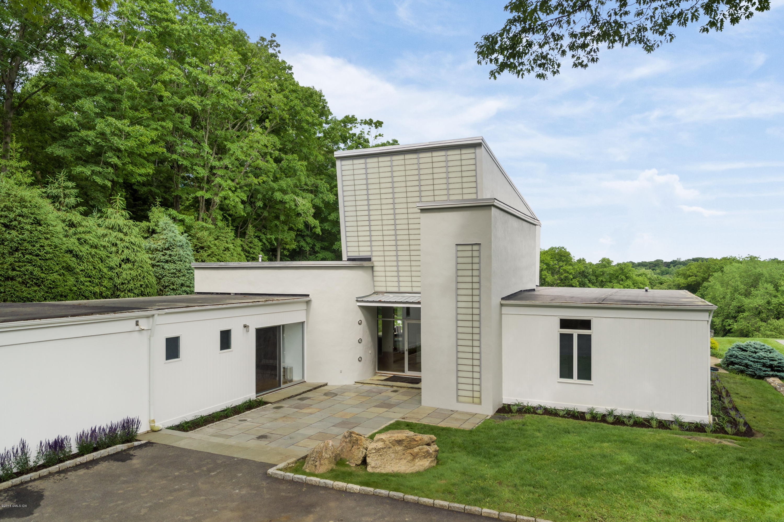 491 Riversville Road Greenwich, CT 06831 - Photo 26 of 30 a view of house with backyard and garden