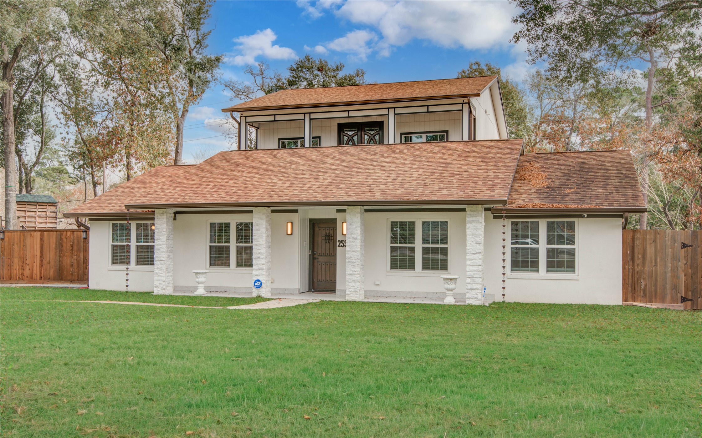 front view of a house with a yard