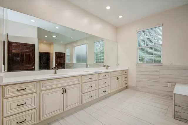 a bathroom with a bathtub and a sink