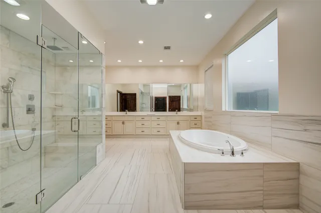 a bathroom with a shower and a sink