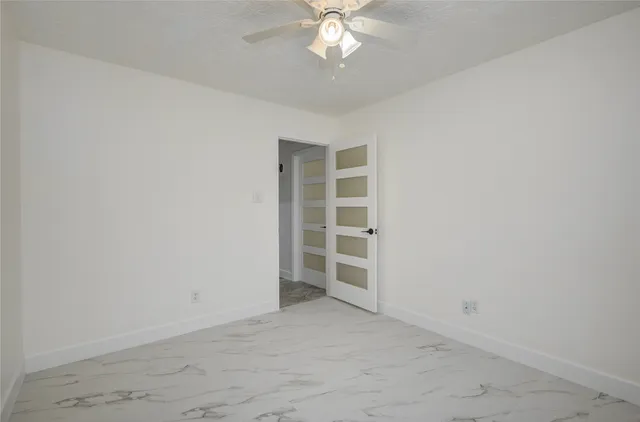 a bathroom with a shower and a toilet