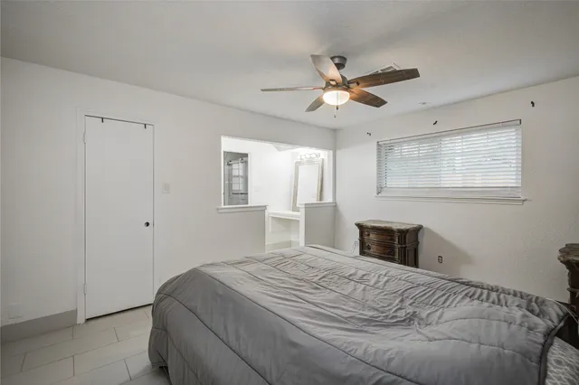 a bathroom with a shower and a mirror