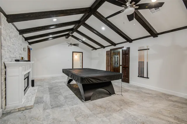 a view of an empty room with a fireplace