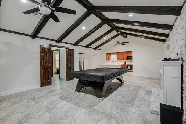 a room with gym equipment and a fan