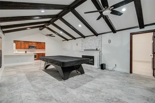 a view of an empty room with a fireplace