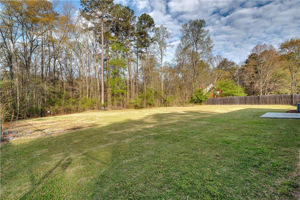 592 Linda Lane Powder Springs, GA 30127 - Photo 21 of 21 a view of outdoor space with yard and trees all around