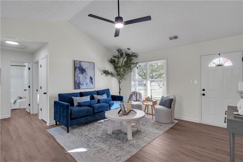 592 Linda Lane Powder Springs, GA 30127 - Photo 4 of 21 a living room with furniture potted plant and a window