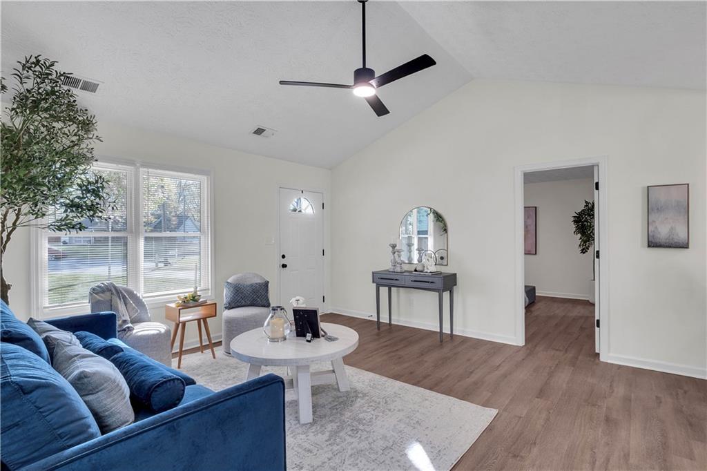 592 Linda Lane Powder Springs, GA 30127 - Photo 5 of 21 a living room with furniture and a wooden floor