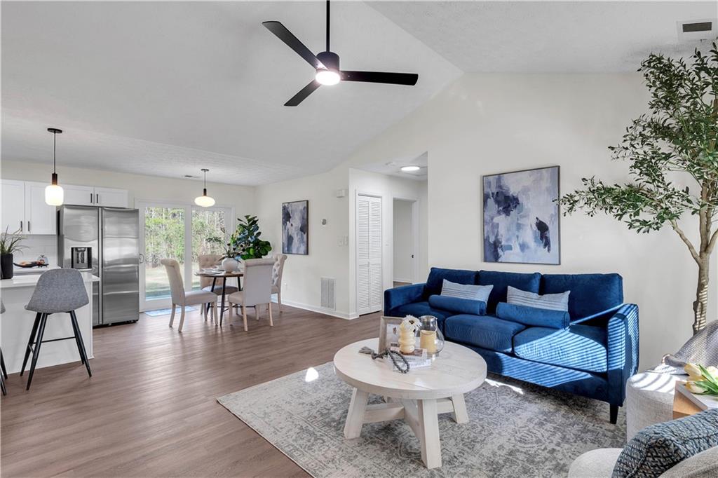 592 Linda Lane Powder Springs, GA 30127 - Photo 7 of 21 a living room with furniture and a wooden floor