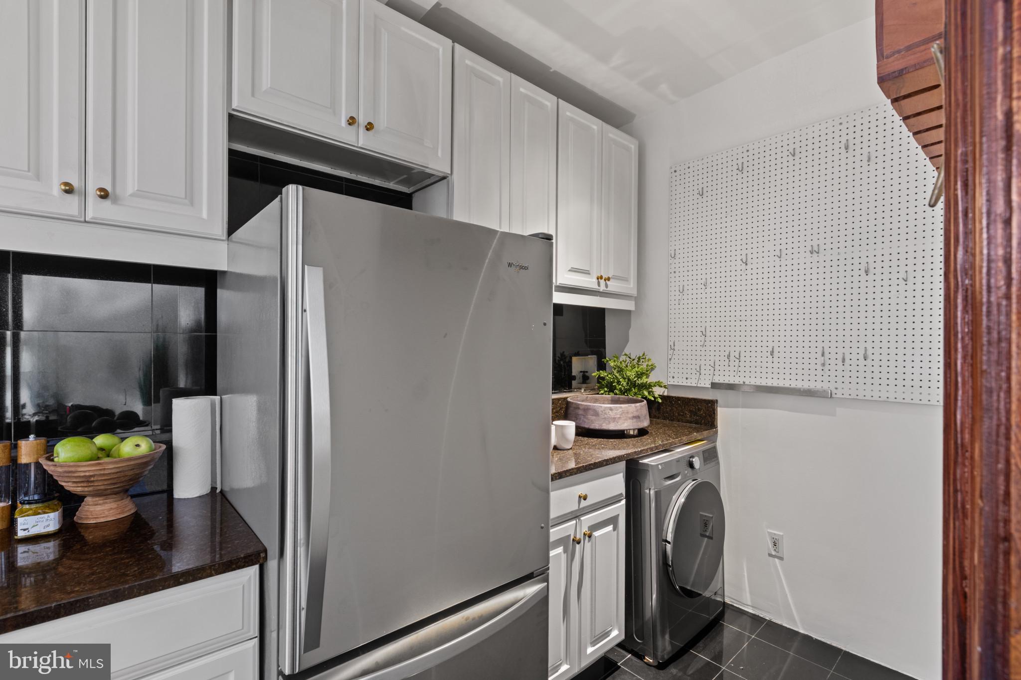 1332 15th Street Northwest, Unit 2 Washington, DC 20005 - Photo 14 of 28 a kitchen with stainless steel appliances a refrigerator and a stove