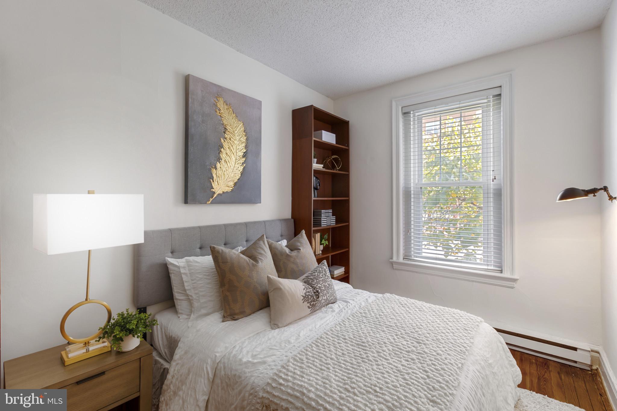 1332 15th Street Northwest, Unit 2 Washington, DC 20005 - Photo 16 of 28 a bedroom with bed and a window