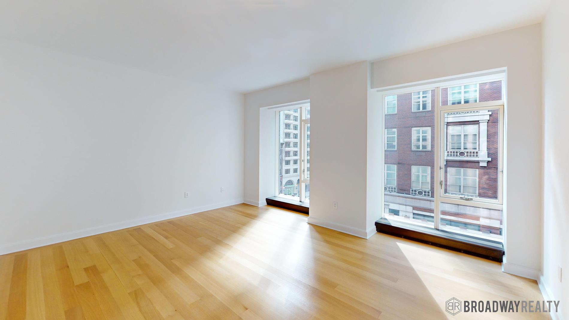 1289 Lexington Avenue, Unit 6B Manhattan, NY 10028 - Photo 10 of 24 a view of an empty room with a window