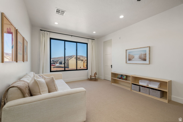4871 South Homestead Way Washington, UT 84780 - Photo 88 of 151 Living area with light carpet and recessed lighting